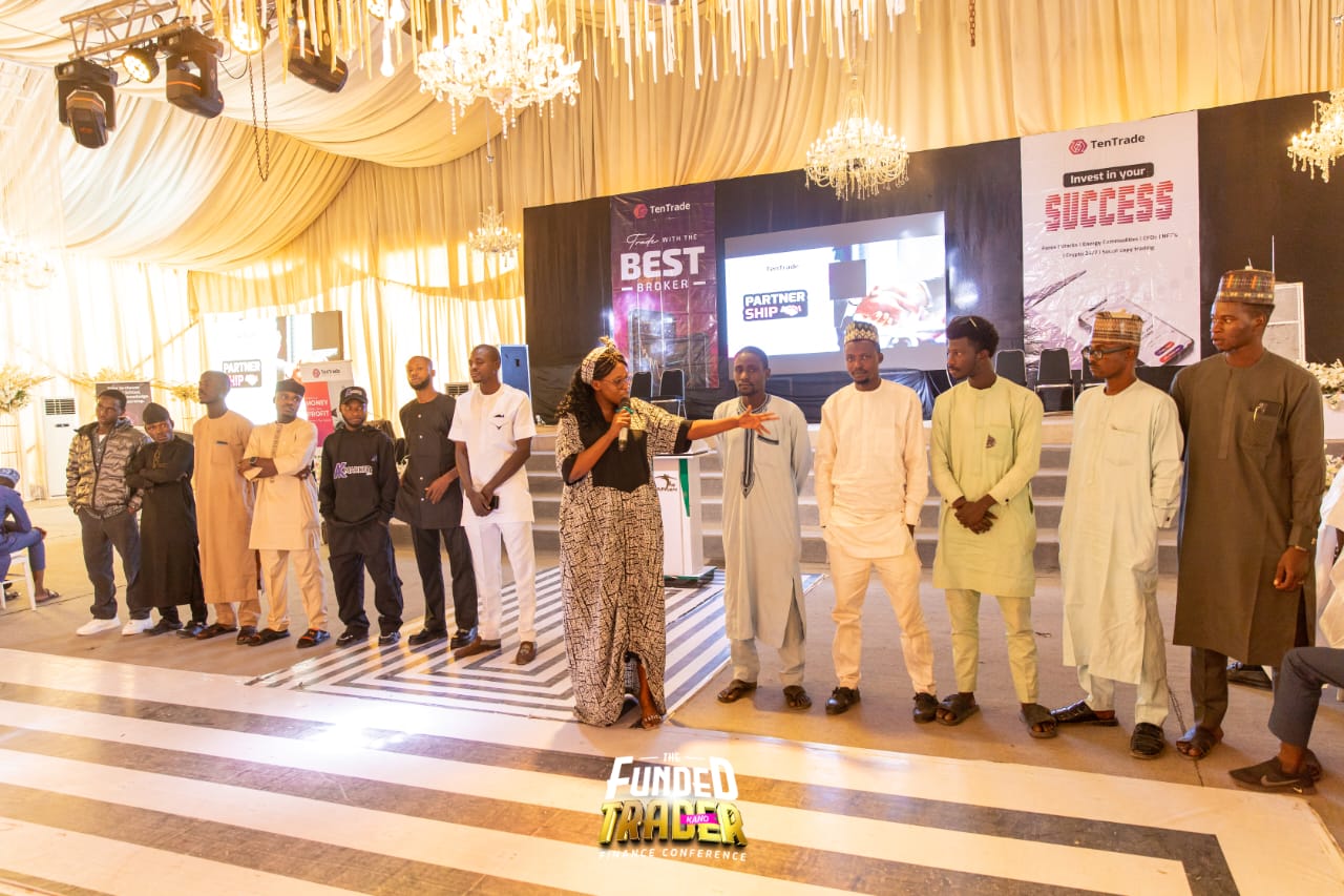 Blessing-Jehova Ubong hosting a line-up of traders on stage in Kano