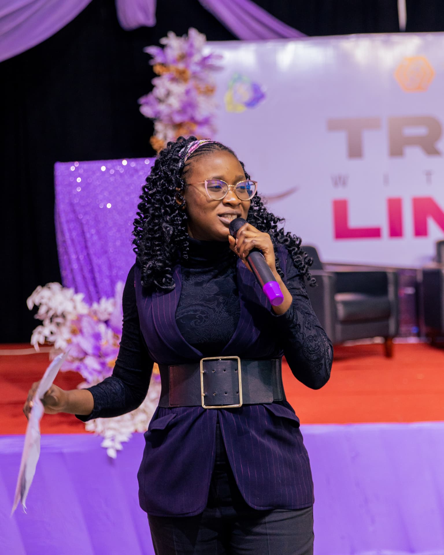 Hosting with a microphone at a TenTrade event