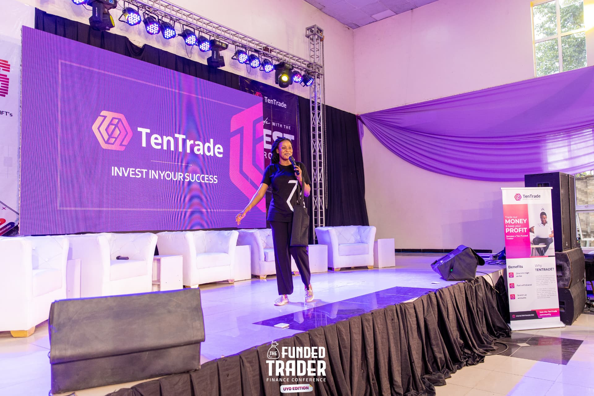 Blessing-Jehova Ubong presenting on stage at the TenTrade Funded Trader conference in Uyo